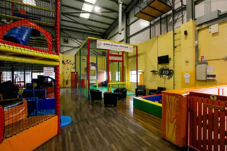 Sofas and a soft play corner beside the main frames